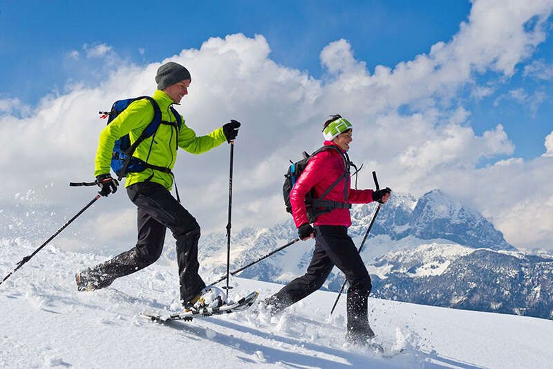 Snowshoeing in front of the Wilder Kaiser